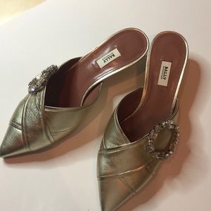 Gold slides with buckle detail from Bally